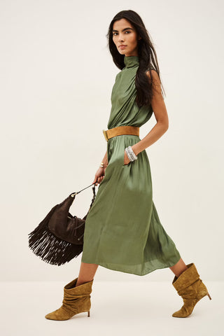 Ba&sh Dress Celea Kaki. Model is walking white wearing the product. Image is shot on white background. 