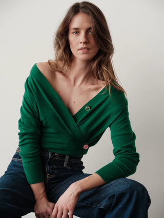 CISSA The Wrap Cardigan Grass Cashmere Blend. Model is bent down and is wearing the product shot on a white background. 