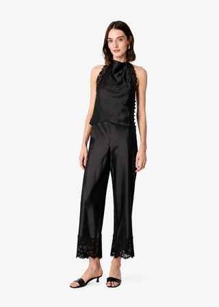 Cami NYC Bristol Mid Rise Lace Pant Black. Model is wearing the product and image is shot on white background. 