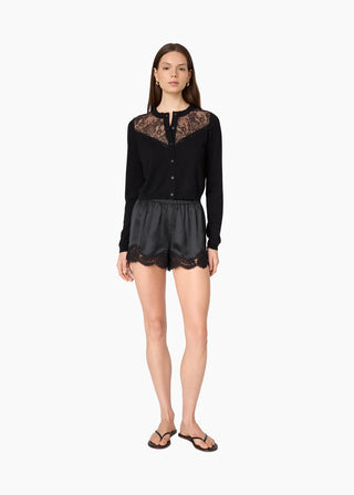 Cami NYC Harleth Cardigan Black. Model is wearing the product and image is shot on white background. 