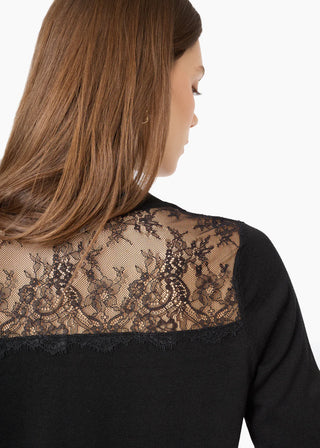 Cami NYC Harleth Cardigan Black. Product is shot on the model from the back. 
