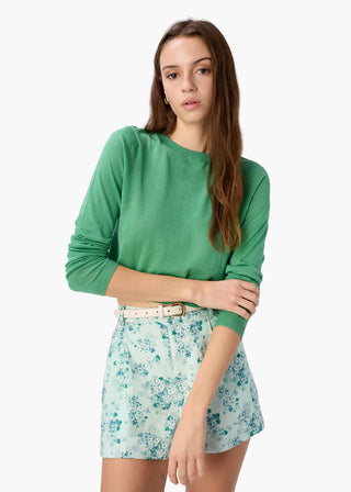 Cami NYC Jaye Cropped Knit Top. Model is posing with the product shot on a white background. 