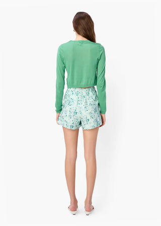 Cami NYC Jaye Cropped Knit Top. Model is turned around wearing product shot on white background. 