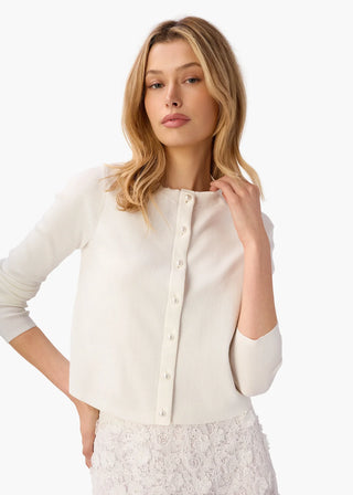 Cami NYC Jessa Cardigan White. Model is wearing product shot on a white background. 