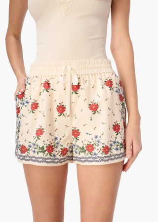 Cami NYC Oslo Silk Cotton Short Heirloom Bandana. Model is wearing the shorts and the image is shot up close on a white background. 