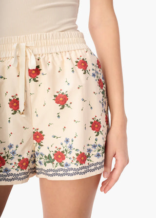 Cami NYC Oslo Silk Cotton Short Heirloom Bandana. Model is wearing the shorts and they are shot up close. 