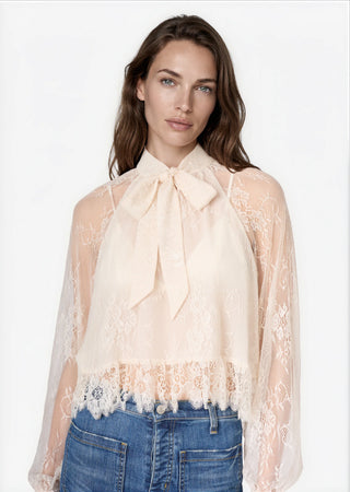 Cami NYC Tully Lace Blouse Oat. Model is wearing product.