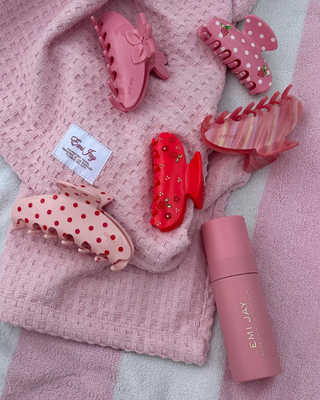 Emi Jay Big Effing Claw Clip in Blush Polka Dot. Product displayed with other Emi Jay products. 