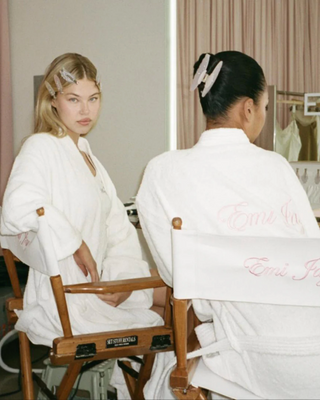 Emi Jay Big Effing Claw Clip in Eveyday Angel. Models wearing the clip on a chair. 
