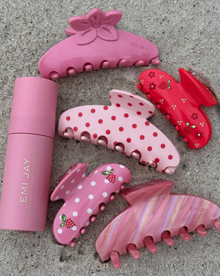 Emi Jay Big Effing Claw Clip in Lychee Baby. Hair clip displayed with other Emi Jay clips. 