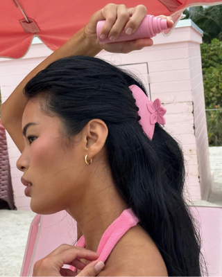 Emi Jay Big Effing Claw Clip in Lychee Hibiscus. Model wearing hair clip. 