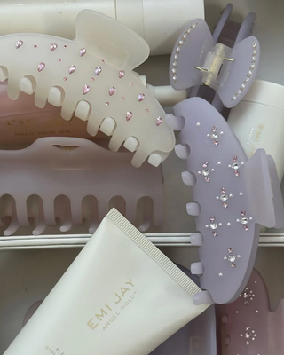 Emi Jay Big Effing Claw Clip in Morning Angel. Clip displayed with other Emi Jay products in a box. 