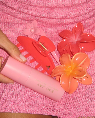 Emi Jay Big Super Bloom Clip in Peach Spritz. Hair clip is displayed with other Emi Jay products.