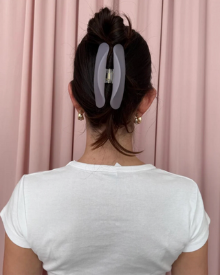 Emi Jay Half Moon Clip in Lilac Smoke. Model wearing hair clip. 
