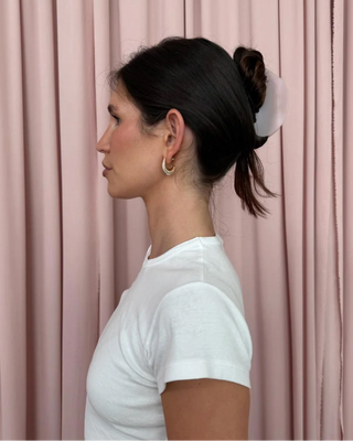 Emi Jay Half Moon Clip in Pink Smoke. Model wearing hair clip. 