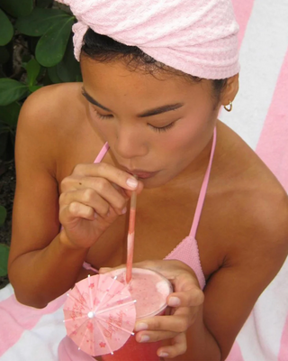 Emi Jay Heavenly Hair Towel Lychee Baby. Model posing with towel in her hair. 