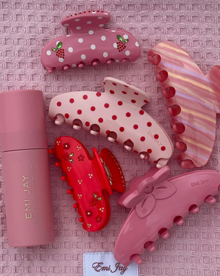 Emi Jay Sweetheart Hair Clip in Berry Beach Club. Product displayed with other Emi Jay products.