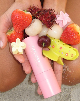 Emi Jay Sweetheart Hair Clip in Citrus Baby Bloom. Hair clip is next to fruit and other Emi Jay products.