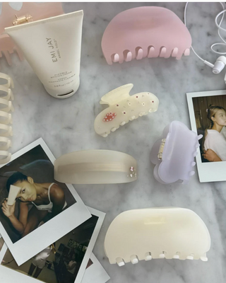 Emi Jay Sweetheart Hair Clip in Cloud Kiss. Hair clip displayed with other Emi Jay products.