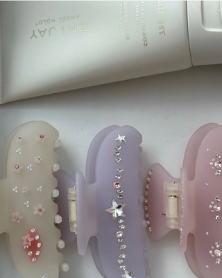 Emi Jay Sweetheart Hair Clip in Lilac Sky. Hair clip displayed next to other Emi Jay clips. 