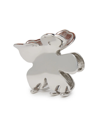 Lele Sadoughi Silver Lily Claw Clip laying flat, with curved silver petals and a strong claw grip underneath.