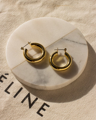 Luv AJ baby amalfi Hoops Gold "luv aj tube hoops" "luv aj gold hoops" "luv aj baby gia hoops" "luv aj pave hoops" "luv aj amalfi hoops" "luv aj hoops in gold” "luv aj gold plated" "luv aj gold earrings" "luv aj gold hoops" "luv aj pave hoops"