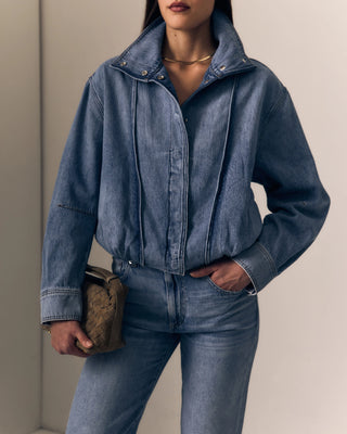 Le Jean Bubble Jacket. Model is wearing jacket and is posing. 