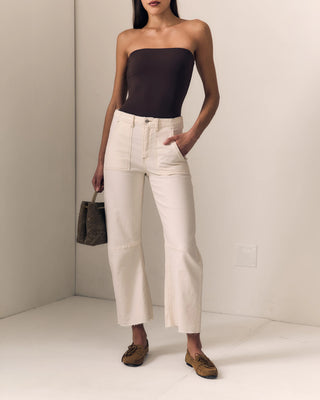 Le Jean Utility Soft Barrel. Model is wearing the pants and has her hand in her front pocket. 