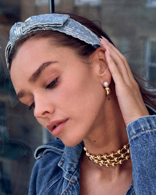 Lele Sadoughi Gold Pebble Stud Earring. Model is wearing the product. 