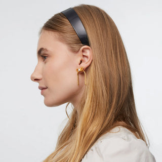 Lele Sadoughi Jet Emma Acetate Headband. Model is wearing the product turned to the side shot on a white background.