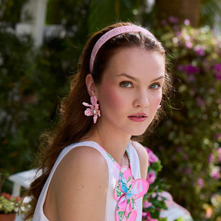 Lele Sadoughi Terrazzo Blush Emma Acetate Headband. Model is in nature wearing the product. 