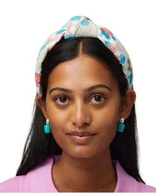 Lele Sadoughi Turquoise Sea Pebble Stud Earring. Model is wearing product shot on a white background. 