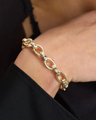 Melinda Maria Ashley Chain Link Bracelet. Model is wearing product. 