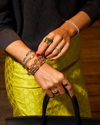 Melinda Maria Ashley Chain Link Bracelet. Model is wearing the product along with other jewelry. 