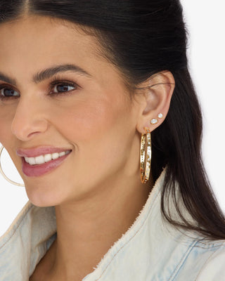 Melinda Maria Ashley Infinity Reversible Hoops 2". Model is wearing product. 