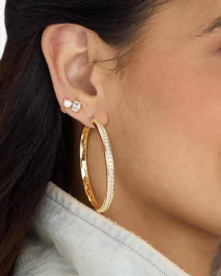 Melinda Maria Ashley Infinity Reversible Hoops 2". Model is wearing product. 