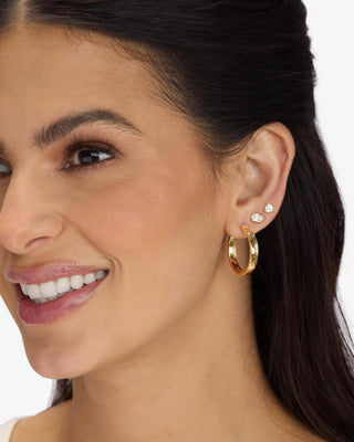 Melinda Maria Ashley Reversible Hoops 1". Model is wearing the product. 
