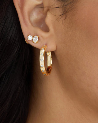 Melinda Maria Ashley Reversible Hoops 1". Model is wearing the product. 