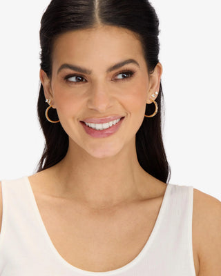 Melinda Maria Ashley Reversible Hoops 1". Model is wearing the product shot on white background. 