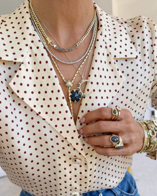 Melinda Maria David Ring Gold Labradorite. Model is wearing the necklace along with other products. 