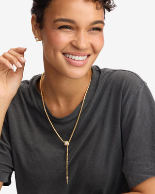 Melinda Maria Jaguar Bolo Lariat Necklace. Model is wearing the necklace.