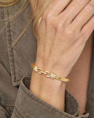 Melinda Maria Knot Cuff. Model is wearing product. 