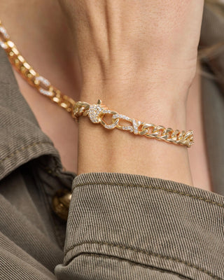 Melinda Maria Knot Figaro Chain Bracelet. Model is wearing the product. 