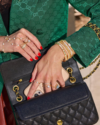 Melinda Maria Perfect Pearl Hand-Chain. Model is wearing product. 
