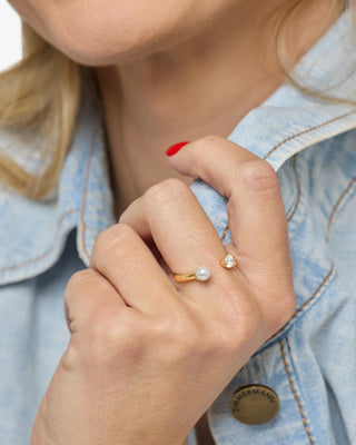 Melinda Maria Perfect Pearl Open Ring. Model is wearing the ring. 