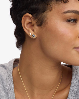 Melinda Maria She's a Boss Studs 8mm Gold Labradorite. Model is wearing the studs. 