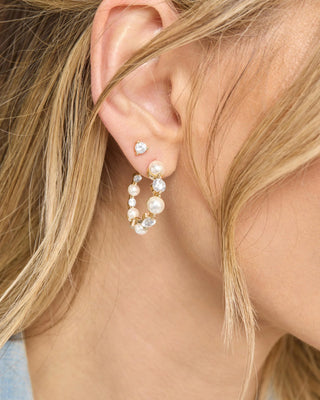 Melinda Maria She's an Icon Pearl Hoops 1". Model is wearing the product. 