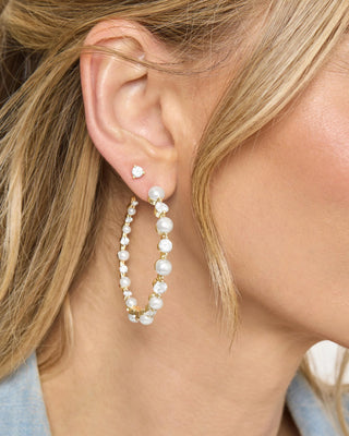 Melinda Maria She's an Icon Pearl Hoops 2", Model is wearing the product. 