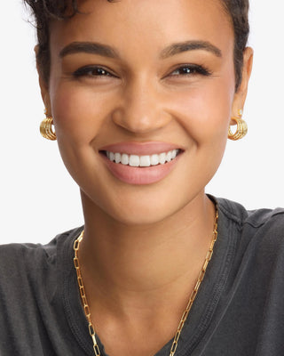 Melinda Maria Talon 5 Row Hoops. Model is wearing the earrings.