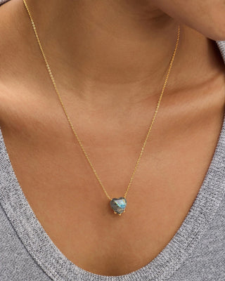 Melinda Maria The Allison Gold Labradorite Heart Necklace. Necklace is shot up close on model. 